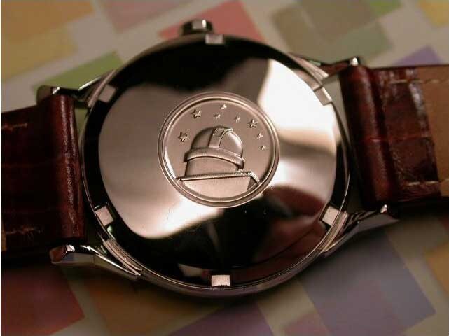 Omega Constellation caseback engraved with the observatory medallion, tower and eight stars